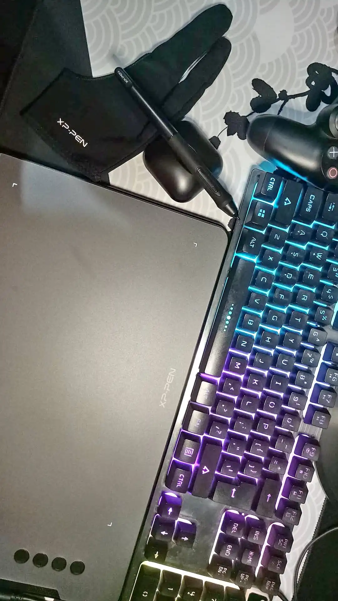 An XP-Pen drawing tablet and stylus beside the keyboard